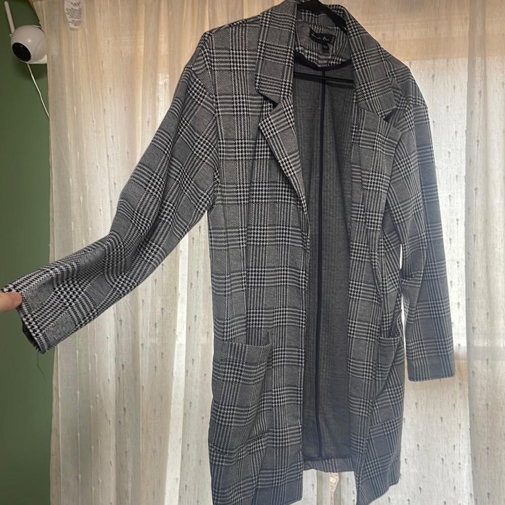 Black grey and white plaid jacket great for business or pleasure